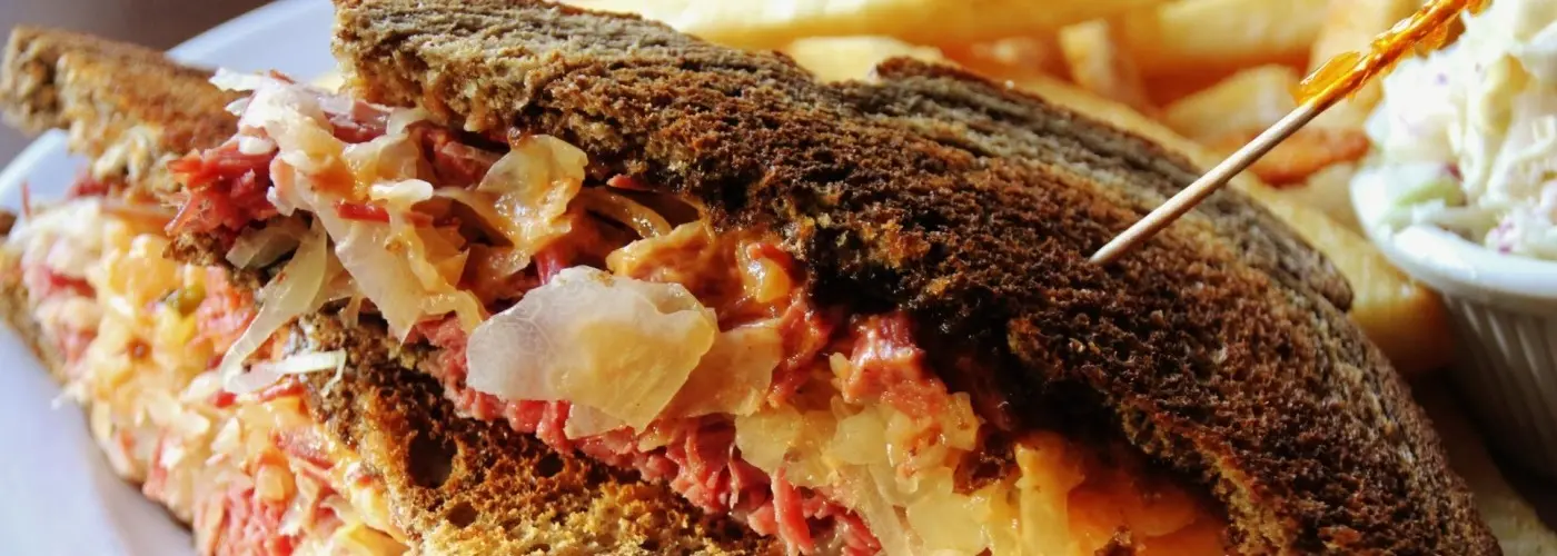Reuben sandwich with corned beef, sauerkraut and Swiss on rye